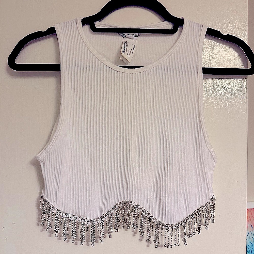 White top with rhinestones at the bottom hem